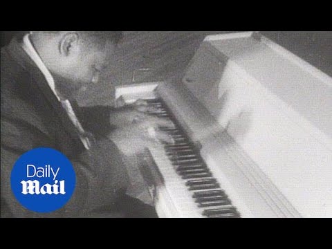 Fats Domino plays the piano in 1956 - Daily Mail