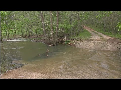 Clearing flood debris from Culvert