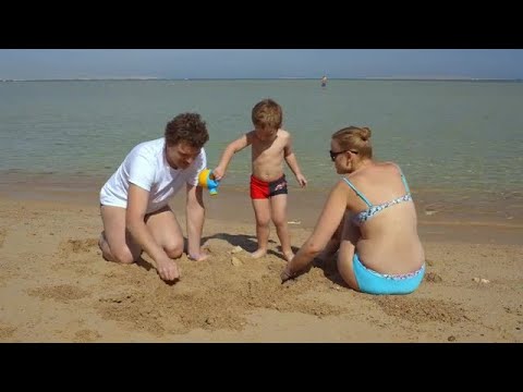 Family Building Sandcastle Stock Video
