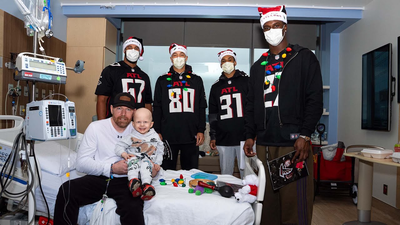 Falcons rookie's sing holiday carols for patients at Children's Healthcare of Atlanta hospital