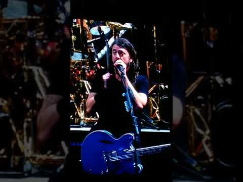 Foo Fighters and John Travolta on stage at Welcome to Rockville