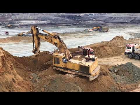 Caterpillar 245B Excavator Loading Trucks With Three Passes