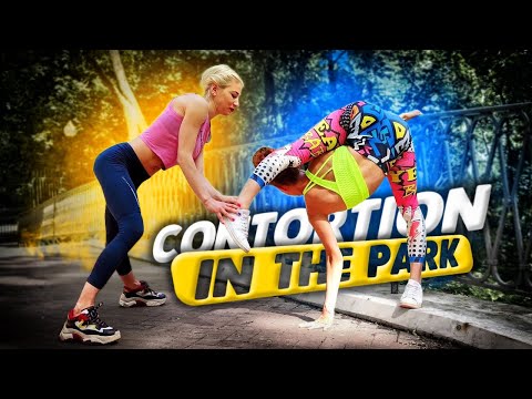 Flexible girls doing contortion in the park. Oversplits and front bend training. Flexshow