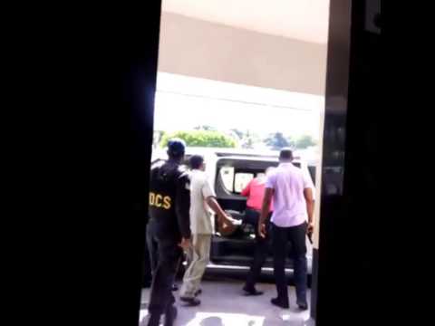 Vybz Kartel Being Escorted by Armed Police Contingent from Hospital