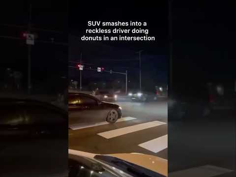 SUV smashes into a reckless driver doing donuts in an intersection, with passengers out the window