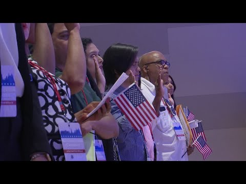 Fifty-two citizenship candidates from over 25 countries took the Oath of Allegiance to become America's newest citizens Tuesday during a naturalization ceremony held at the 9/11 Memorial & Museum in New York. (July 2)