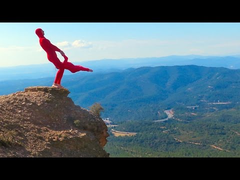 Disabled Acrobat Balancing On Edge Of Mountain