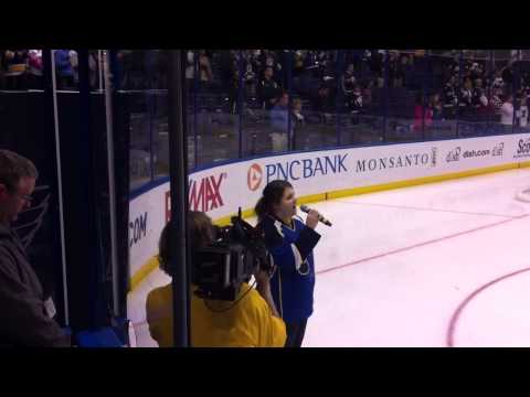 Amie Gossett sings the national anthem before a Blues game