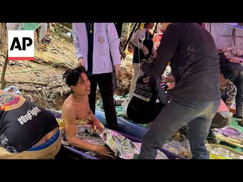 Rescue diver reacts to trapped villagers emerging from flooded Laos cave