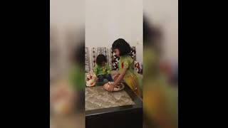 Little sister singing cute song for her brother while tying "RAKHI"