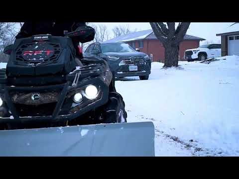 Canam Outlander snowplowing with the ATV Kolpin Switchblade™ Snow Plow System