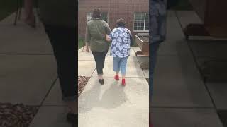 Robin and grandma walking outside rehab