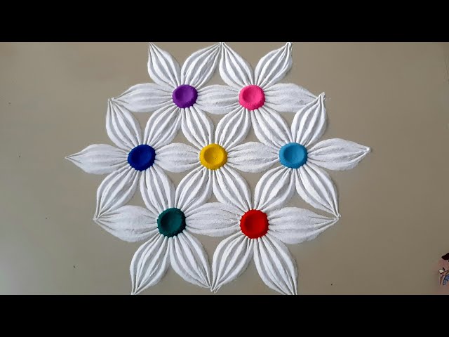 Indian traditional flower theme rangoli design by top rangolis