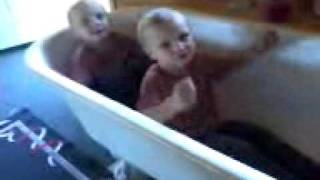 Twins singing Row row Row your Boat..in a bath tub
