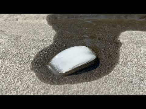 Ice cube melting in hot weather time-lapse