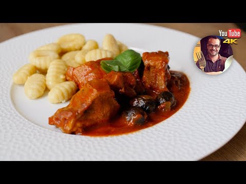 Veal with olives and tomato