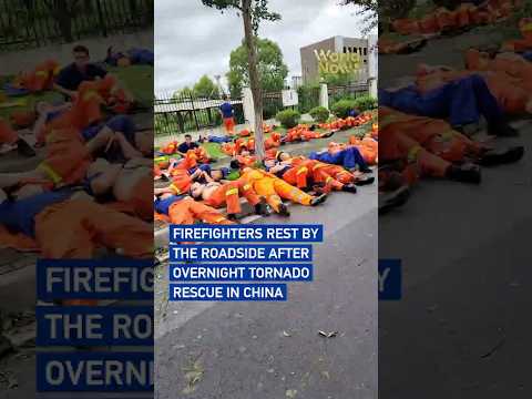 Firefighters rest by roadside after overnight tornado rescue in China  #worldnow