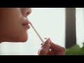 Extreme Close Up Of Woman Applying Lipstick Highlighting Beauty And Skincare Routine