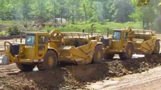 Living on the Edge -- CAT Earthmovers excavating a pond -- 7-22-11.wmv