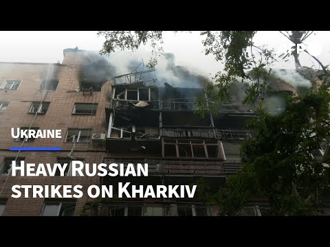 Firefighters tackle smouldering building after Kharkiv strike | AFP