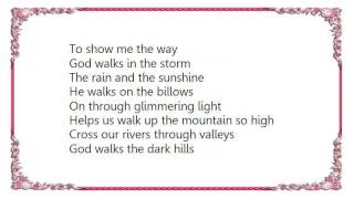 Iris DeMent - God Walks the Dark Hills Lyrics