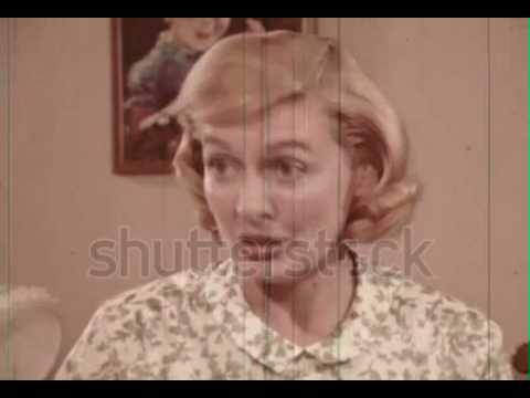 Mother teaches daughter how to use a sanitary belt