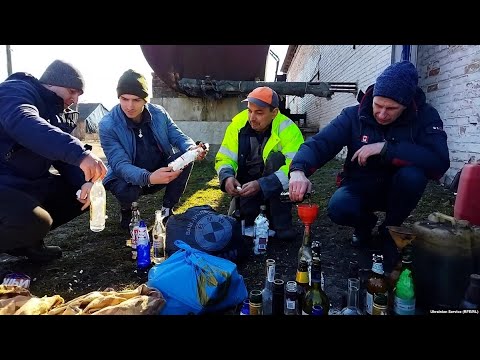 Making Molotov Cocktails, Ukrainian Civilians Prepare To Defend Homes