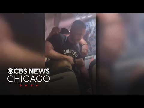 Former MMA fighter helps restrain man who tried to open plane door on flight to Chicago