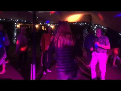 A Silent Disco With Guests Wearing Wireless Headphones & Choice Of Channels Of Music