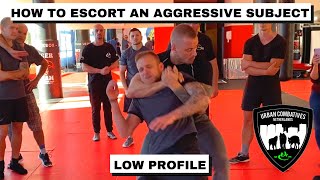 HOW TO ESCORT AN AGGRESSIVE SUBJECT