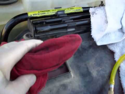 43 45 Cleaning the spark plug well threads after...