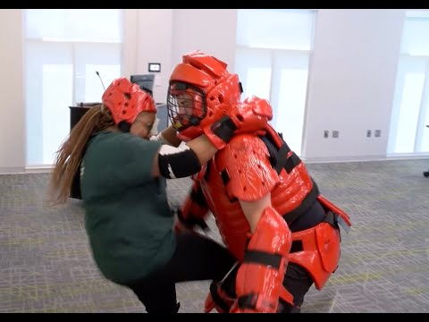 Women learn self defense techniques with RAD training program