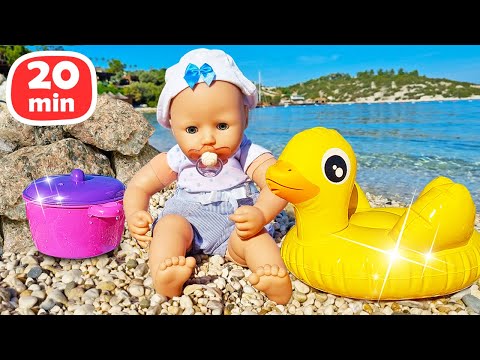 Beach fun with Baby Annabell doll! The baby doll goes for a walk and plays with toys at the beach.