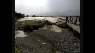 preview picture of video 'Oman - rare video of wadi (flood water) crossing the road..'
