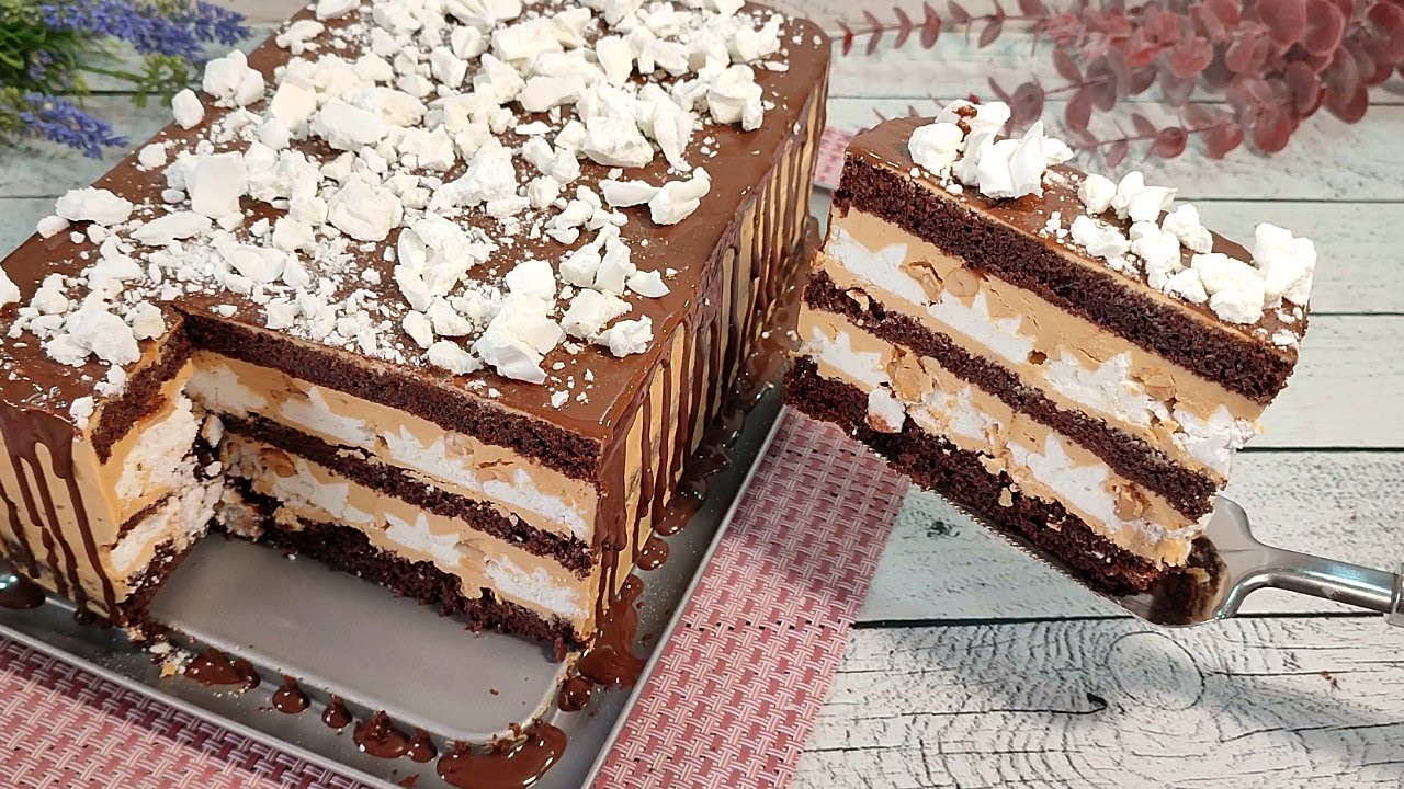 Chocolate cake with meringue and caramel cream with peanuts
