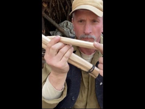 Two-stick hearth for bow drill fire - method used by bushcraft legend Mors Kochanski