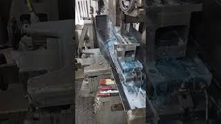 Surface grinding a thread roller ram.