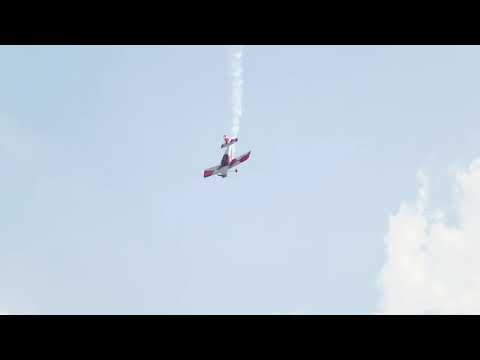 small airplane flying in an extreme acrobatics exhibition perform dead loop