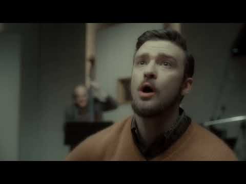 Trailer collage: Gaslight stage, a Chicago audition room, and a studio mic; the music toggles from solo austerity to glossy blend