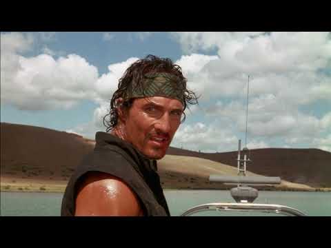 Sahara (2005) official trailer frame — Dirk Pitt, Al Giordino, and Dr. Eva Rojas racing across the desert