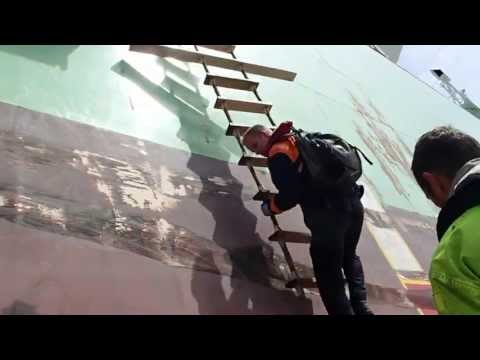 Gas tanker Odin sailing from 7e Petroleumhaven, Rotterdam to sea: pilot disembarking by pilot ladder