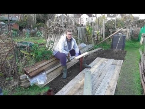 Vivi's Kitchen Garden 56: Work on the deck/fence continues - laying the deck planks.