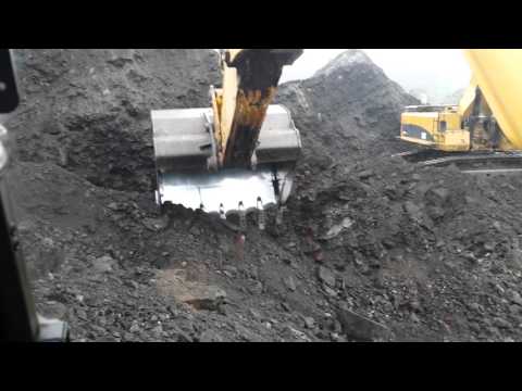 Komatsu pc800 lc loading truck with 2 pases (in cab)