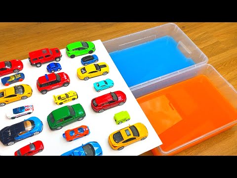 Various Diecast Model Cars Sliding Into The Yellow And Blue Water
