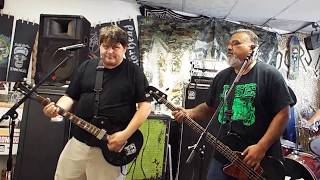 Ese playing "My Homeboy Is A Joto" (Manic Hispanic cover,) at Chain Reaction Records