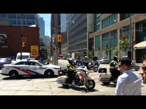 Ambulance with police motorcycle escort