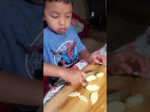 First time cutting apples,cucumber and carrots