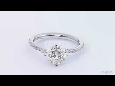 Twist side stone solitaire four claw platinum white gold engagement ring