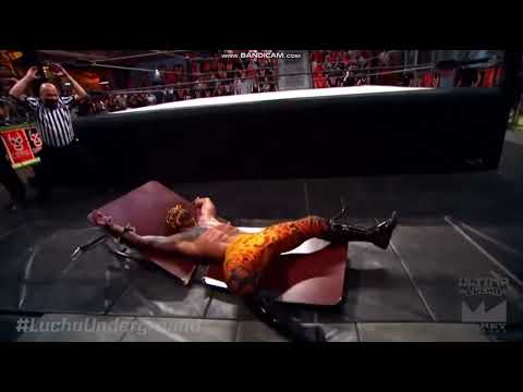 Mil Muertes powerbombs Prince Puma through table