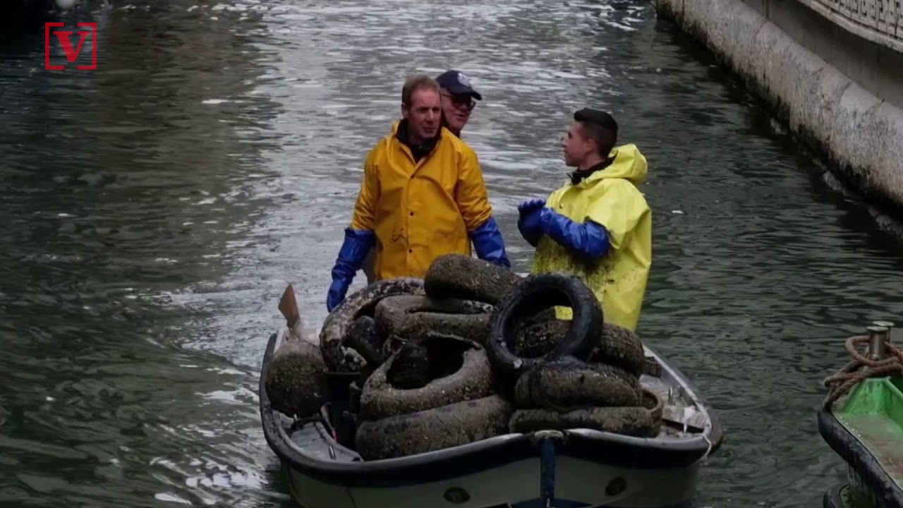 Scuba Divers Help Clean Up Venice Canals After Historic Flooding